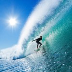 Surfer on a Blue Ocean Wave