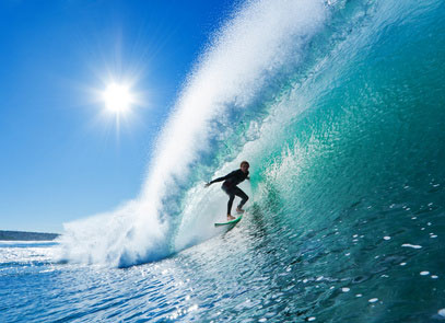 Surfer on a Blue Ocean Wave