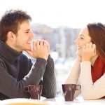 Couple Gazing into Each Other's Eyes over Coffee
